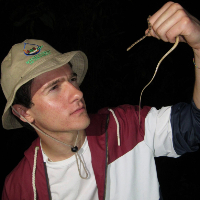 Tito examining a snake in Costa Rica