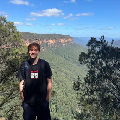 Luke with a scenic forest background