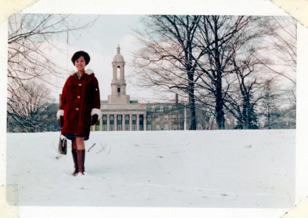 Vivian Valenty standing in front of Old Main at Penn State's campus.