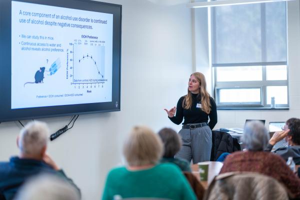Laurel Seemiller, postdoc in Nikki Crowley's lab, speaks to members of the Village at Penn State. 