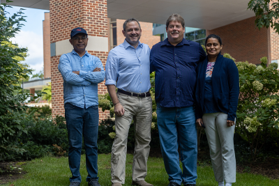 Tapas Mal, Scott Showalter, Larry Johns, and Christy George outside the Chemistry Building