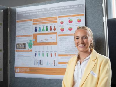 Fiona McConnell in front of her poster