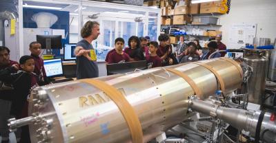 A group of students touring the rocket lab.
