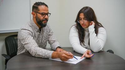 Professor Amine talks with learning assistant Jood