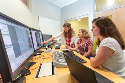 Hafenstein (left) consults with assistant research professors Jennifer Gray (center) and Danielle Hickey (right) in the main control room for the Titan/Krios microscope. Credit: Nate Follmer, Penn State.