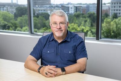 John Warner sitting at table