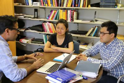 Murali Haran with students in office