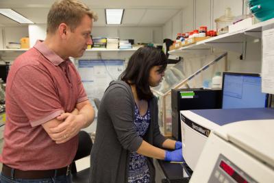 Ken Keiler with student in lab