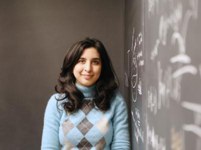 Sara Jamshidi next to chalk board