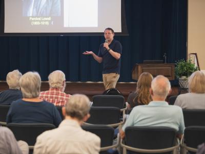 Jason Wright, director of the Penn State Extraterrestrial Intelligence Center and professor of astronomy and astrophysics, speaks to residents of the Village at Penn State on June 27, 2025.