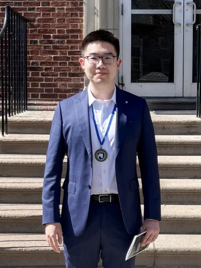 Angkai Li standing in front of the Ritenour Building.