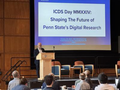 Person presenting at a podium at the 2024 ICDS Symposium.
