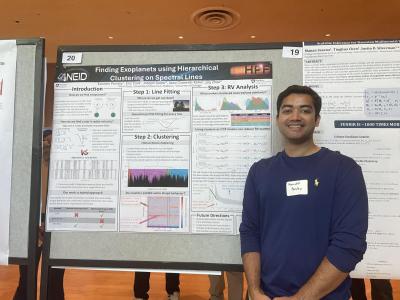 Kanishk Pandey, astronomy and astrophysics doctoral student, standing in front of his poster.