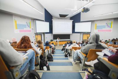 Matt Beckman speaks in a large lecture hall
