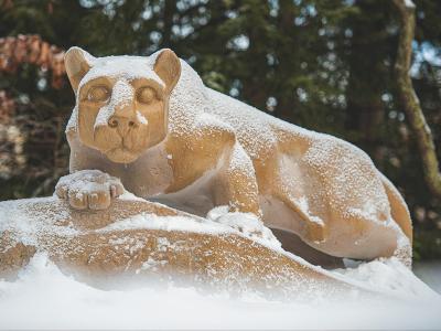 Nittany Lion statue in the snow.