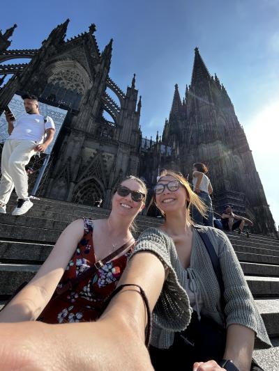 Samantha Seibel and Naomi Huntley taking a selfie in front of a castle at the 2025 QIAGEN internship.