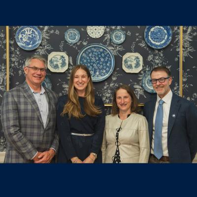 Outstanding Science Alumni Award winners posing for a photo with Dean Tracy Langkilde.