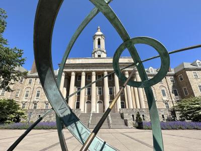 old main viewed through a sculpture