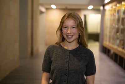 Evelyn Mastaglio stands in a hallway