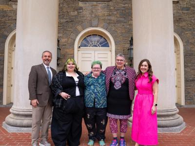 Group of University Staff Advisory Council members and University Staff Advisory Council Staff Award recipients in front of Old Main.
