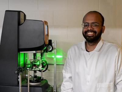 Surendra Padamata sits next to stirring device