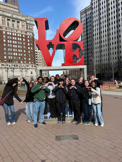 HELP students pose in front of the love statue in Philly