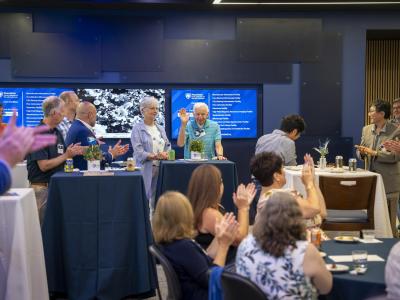 Stephen Benkovic raises his hand at the Huck Institutes 30th anniversary event.