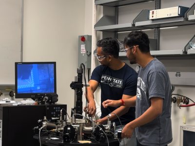 two men work in a laboratory