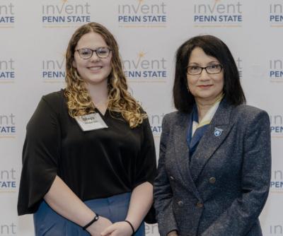 Maya Anderson posing for a photo with Penn State President Neeli Bendapudi.