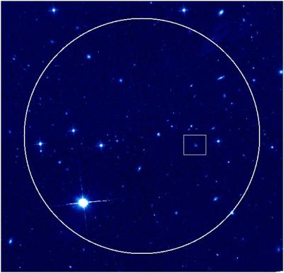 Credit: Derek Fox/Penn State University Hubble Space Telescope image of the sky surrounding the afterglow and host galaxy of the HETE short burst of July 9, 2005. The circle indicates the region of sky that HETE saw the burst from; according to the HETE team we would find the burst within this region. The box, inset, indicates where the X-ray and optical afterglow of the burst was ultimately found. The colors indicate the intensity of red light (814 nm) as seen by the Advanced Camera for Surveys instrument 