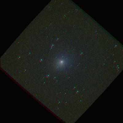 False-color image of Comet Tempel 1 taken on 1 July 2005 with the Swift Ultraviolet Optical Telescope. The picture was formed from images taken separately through V, B, U, and Ultraviolet filters and corrected for the comet's motion before being combined. As a result, the background stars appear as a series of images in different colours.