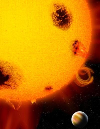 An artist’s rendition shows a planet orbiting a very young, active star pocked with dark star spots and speckled with flares and other surface activity.