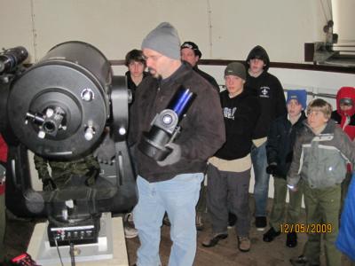 Astronomy lecturer Chris Palma tells a scout troop about different telescopes in the Davey Lab rooftop observatory.