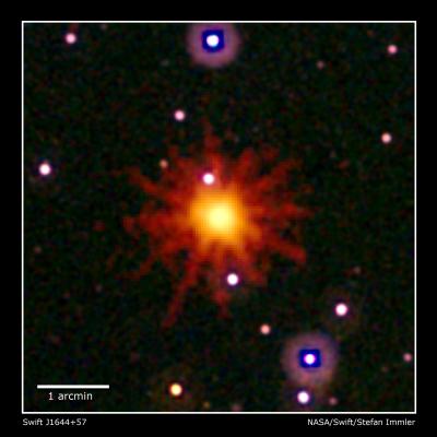 Images from Swift's Ultraviolet/Optical (white, purple) and X-Ray telescopes (yellow and red) were combined to make this view of Swift J1644+57. Evidence of flares is seen only in the X-ray image, a 3.4-hour exposure taken on March 28, 2011. Credit: NASA/Swift/Stefan Immler