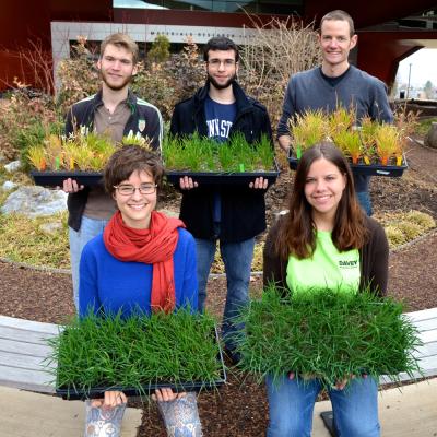 A group of five people smiling holding crops The Fast Farming team, from left to right: junior Liam Farrell, Plant Biology Masters student Nikki Kapp, juniors Jaime Jarrin and Samanta Roa, and Assistant Professor of Biology Dr. Charles Anderson. Credit: Yue Rui