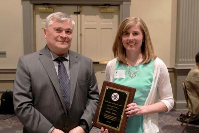 Penn State President Eric Barron, left, presented Jennelle L. Malcos with the 2015 George W. Atherton Award for Excellence in Teaching.