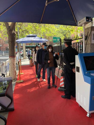 students wearing mask at security checkpoint