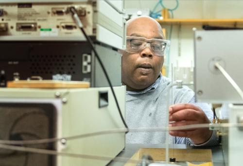 Squire Booker with lab equipment