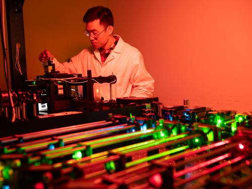 Daguan Nong adjusting the SCATTIRSTORM microscope
