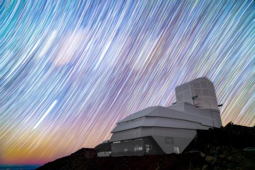 Vera Rubin Observatory with long exposure of stars tracing the sky. Credit: Hernan Stockebrand