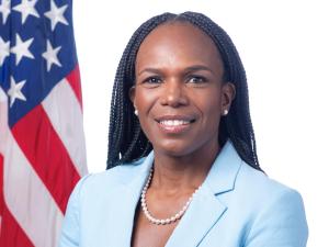 Ala Stanford in front of American Flag. image provided