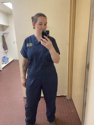 Charley Pero posing for her internship with the Dauphin County Coroner's office and Forensic Science Center.