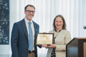 E. John Wherry accepting the Outstanding Science Alumni Award from Dean Tracy Langkilde.