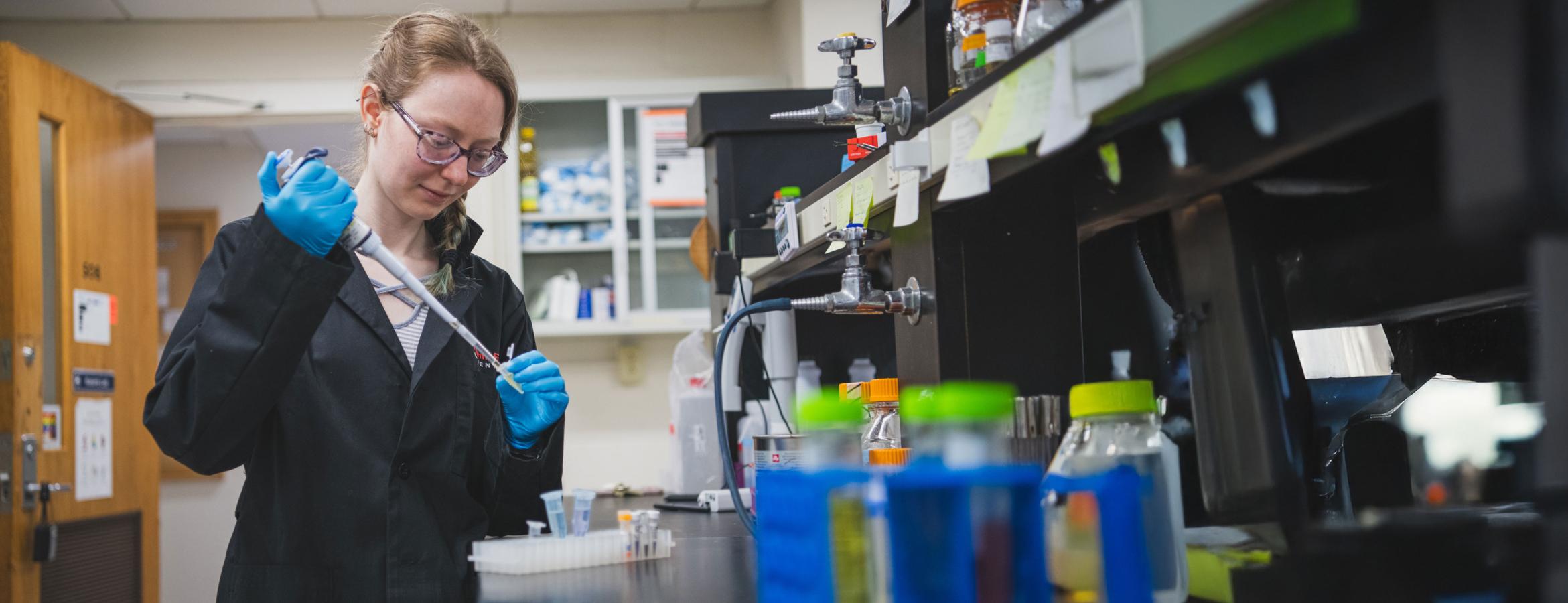 Lauren Bellfy pipettes genetic material in the lab