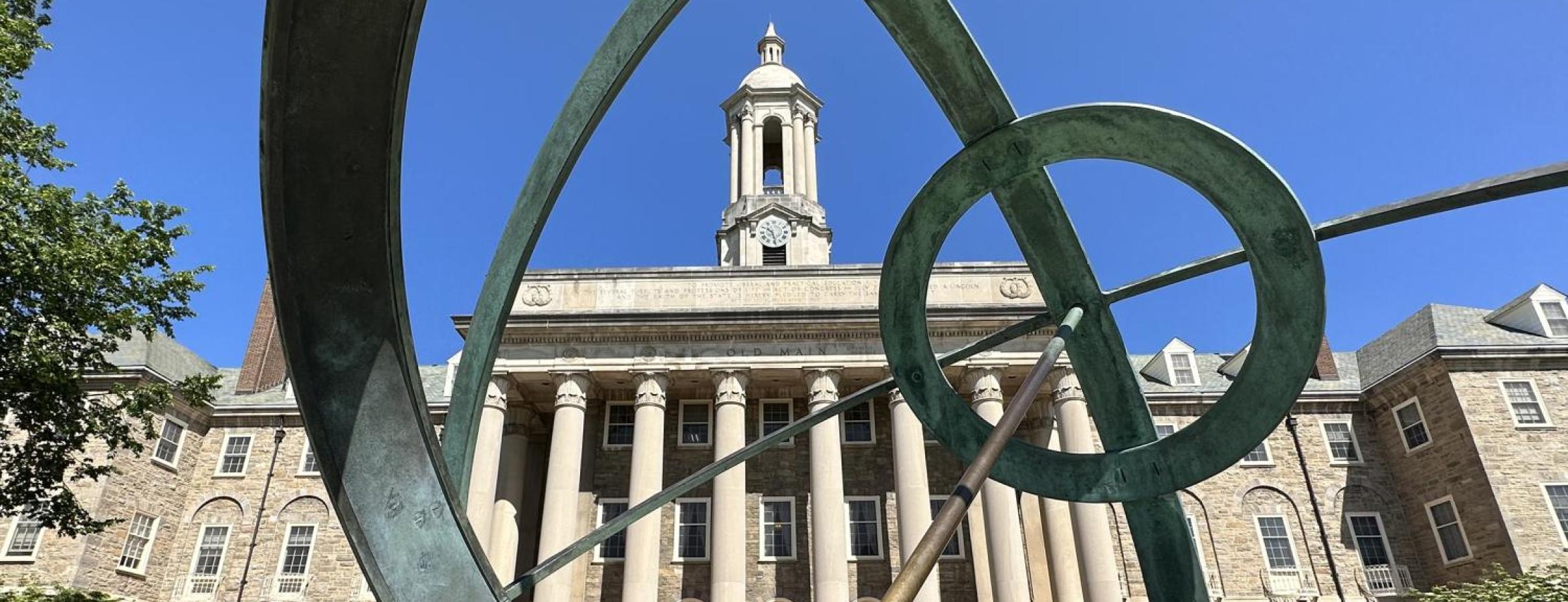 old main viewed through a sculpture