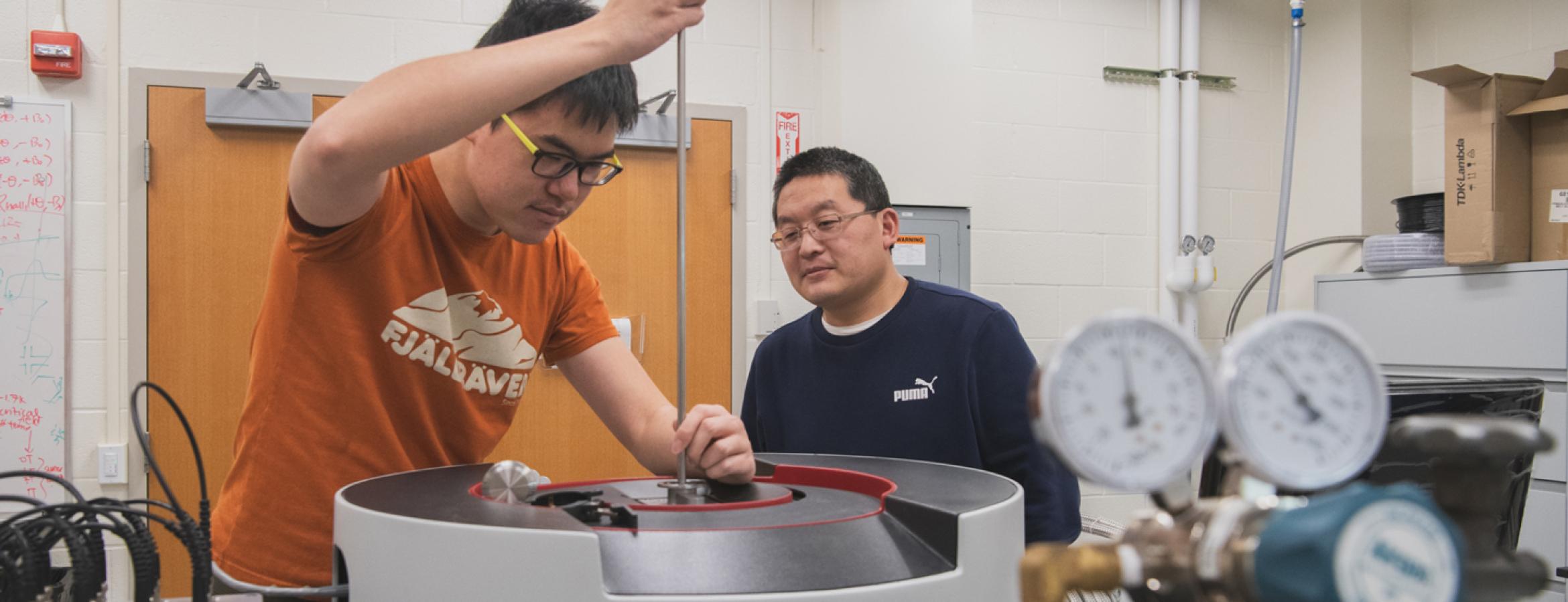 Cui-Zu Chang and a graduate student researcher working in his laboratory in the physics department.