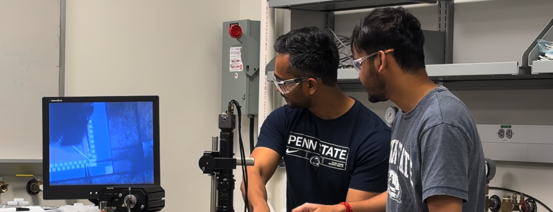 two men work in a laboratory