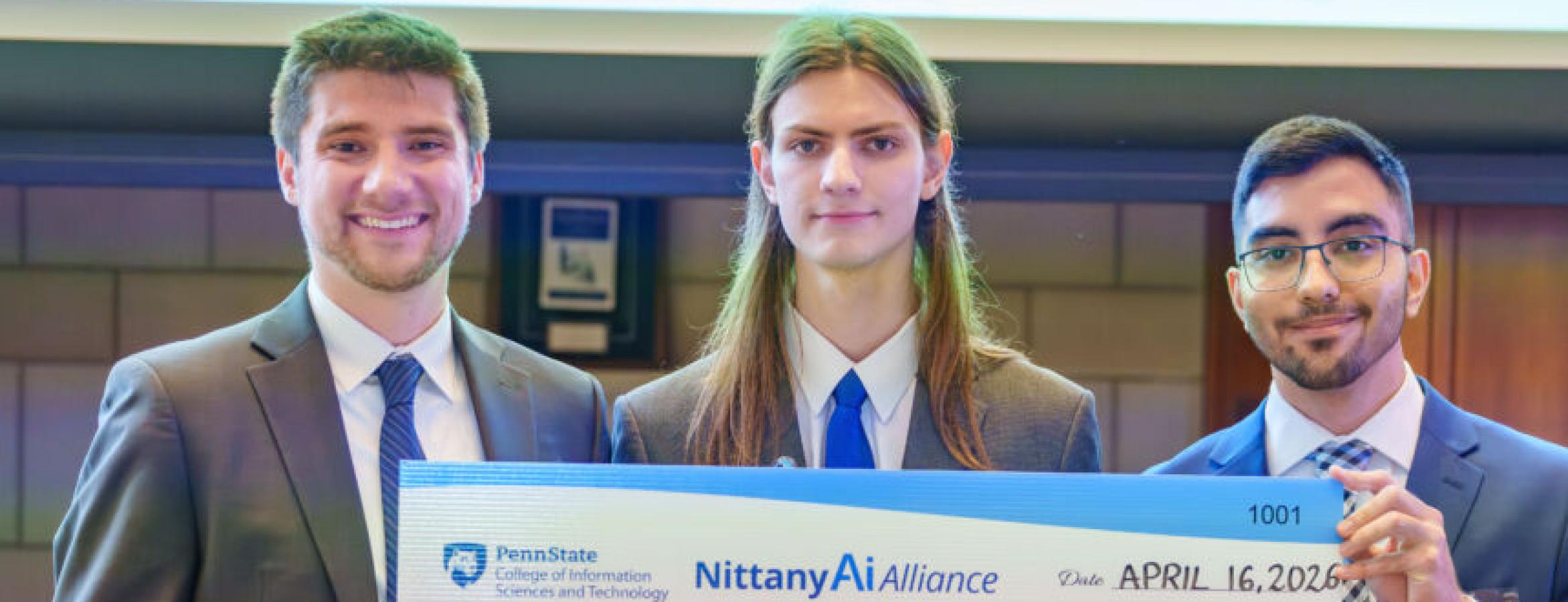 Three contest participants pose with a $2,500 oversized check for MatchMyLab, awarded third place in the Nittany AI Alliance competition.