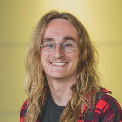 professional portrait of Jakob Helton smiling