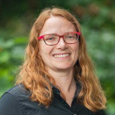 professional portrait of Ana Matković smiling, in front of blurred background